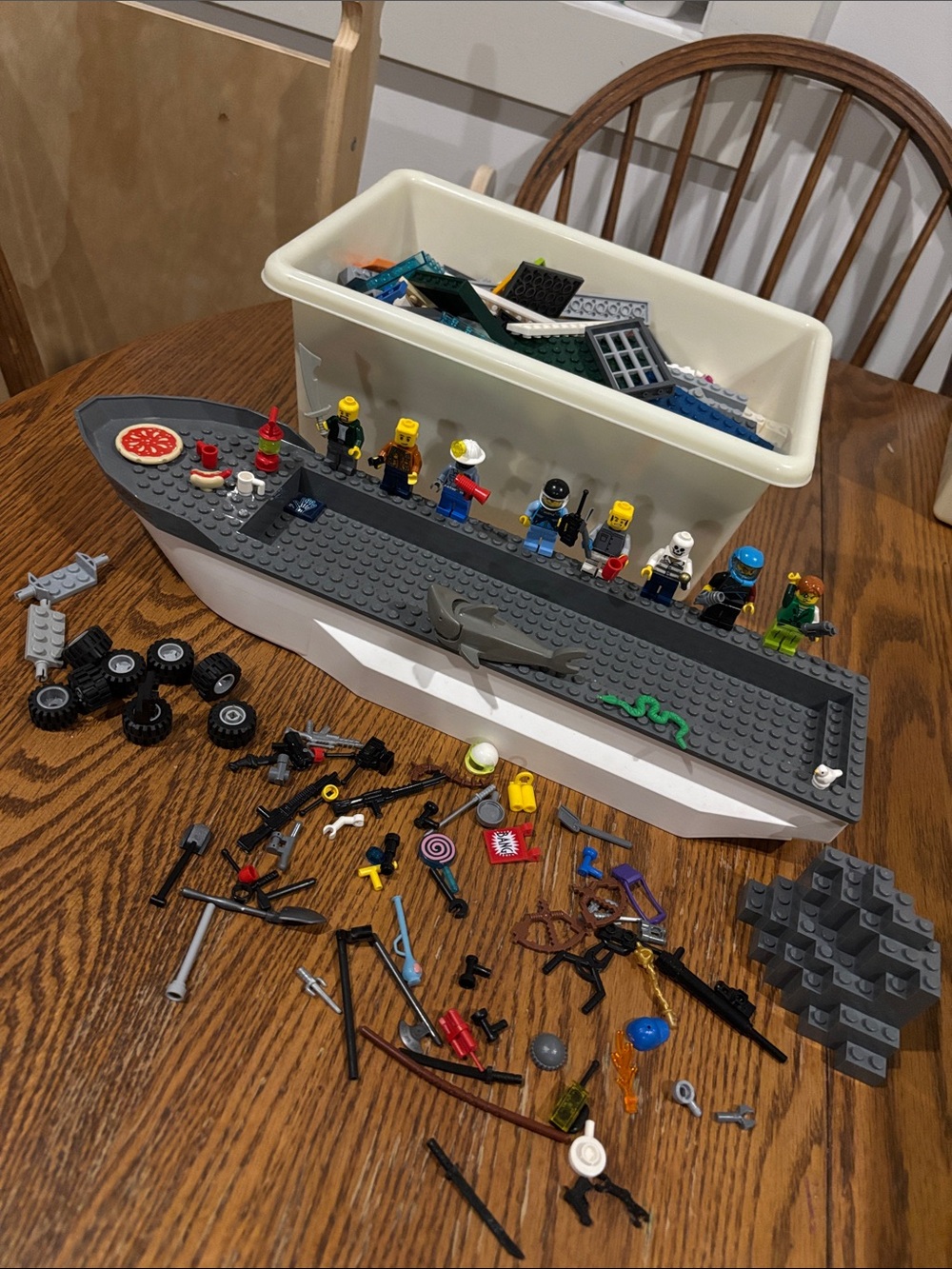Legos with figures and boat with accessories